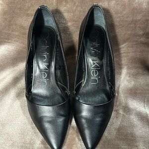 Calvin Klein black leather pumps perfect flight attendant shoes